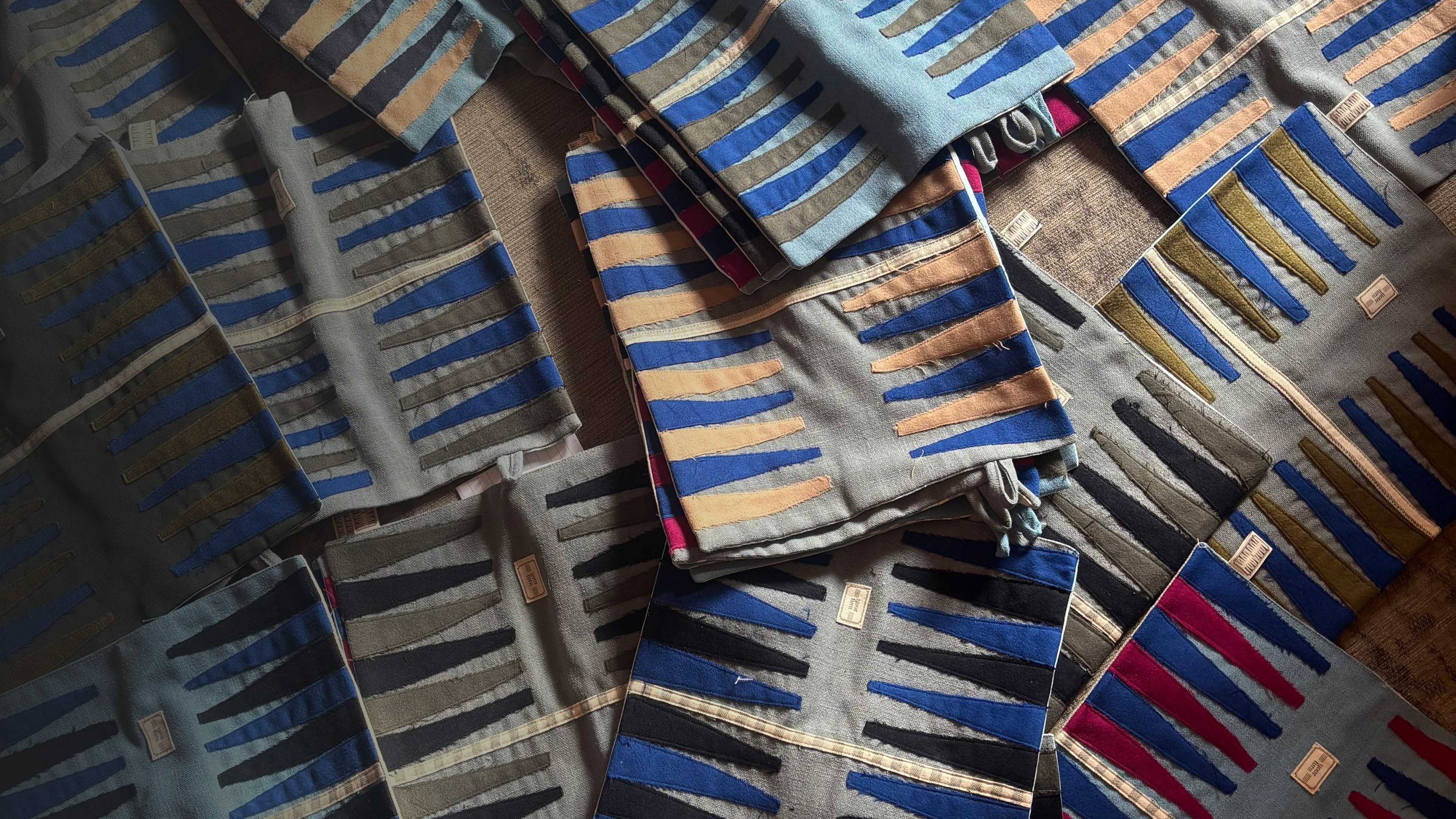 A pile of finished YourTurn boards, no two the same.
